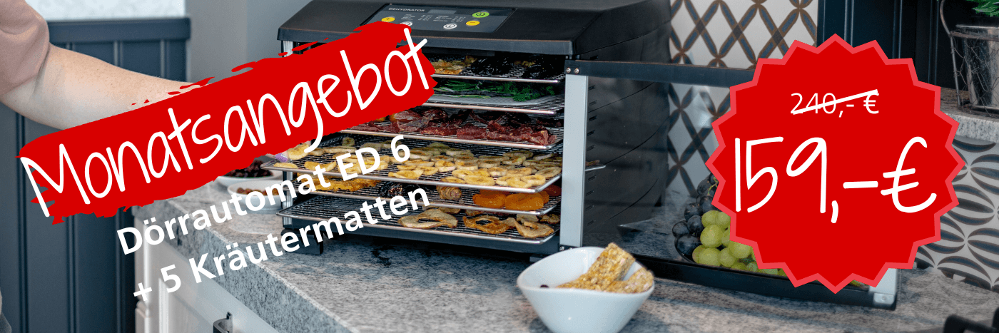 Dörrautomat ED 6 mit 5 Kräutermatten im Monatsangebot für 159 € statt 240 €, platziert auf einer Küchenarbeitsfläche.